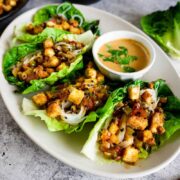 Tofu and vegetable lettuce wraps with peanut sauce