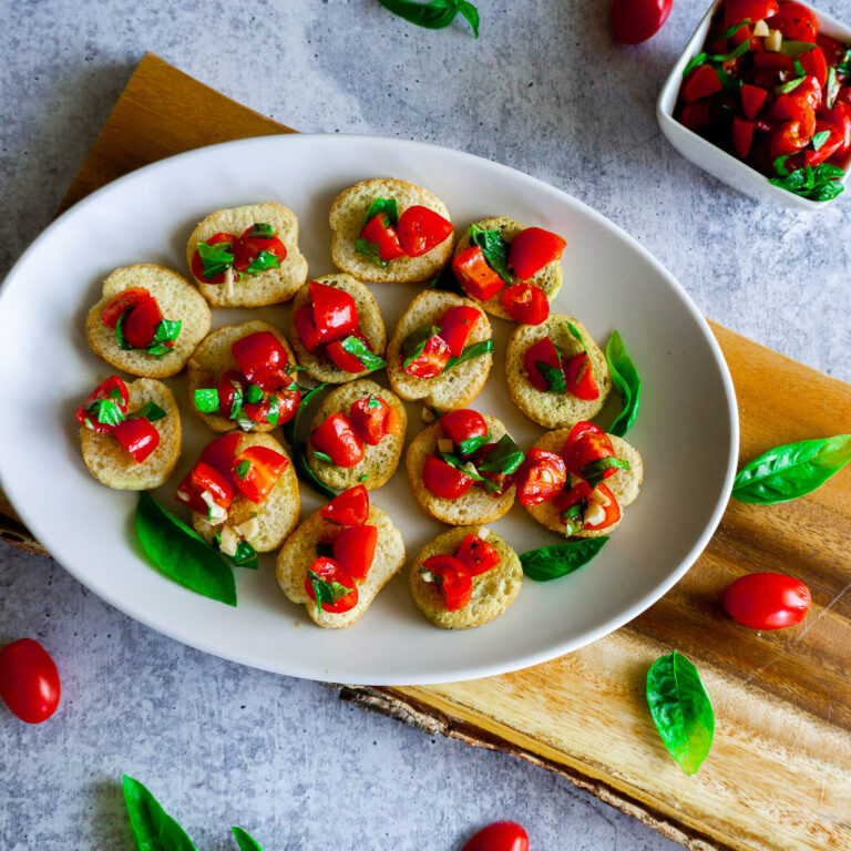 cherry tomatoes on bruschettini toasts