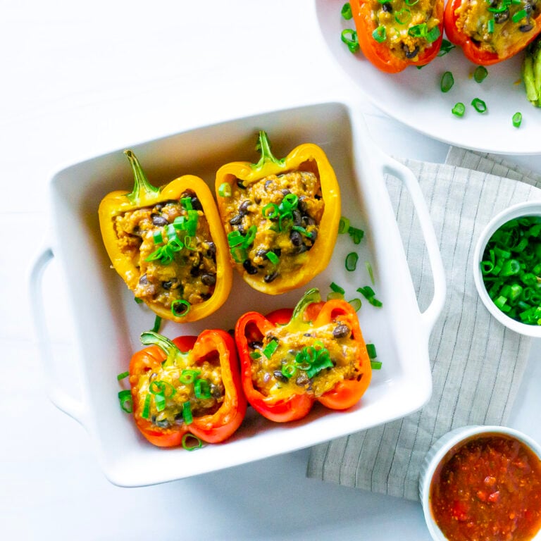 bell peppers with couscous, black beans, cheese, and seasonal vegetables