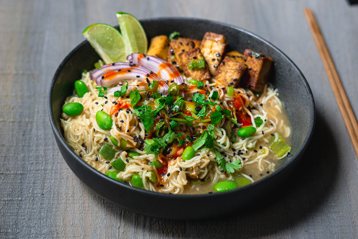 Bowl of maggi noodles with tofu and garnishings
