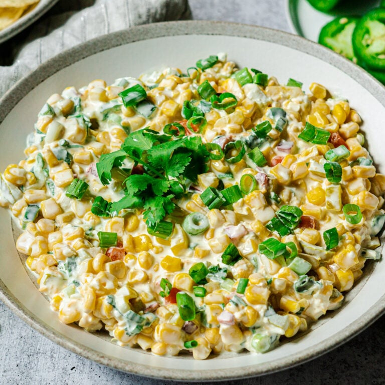 jalapeno corn dip garnished with green onions