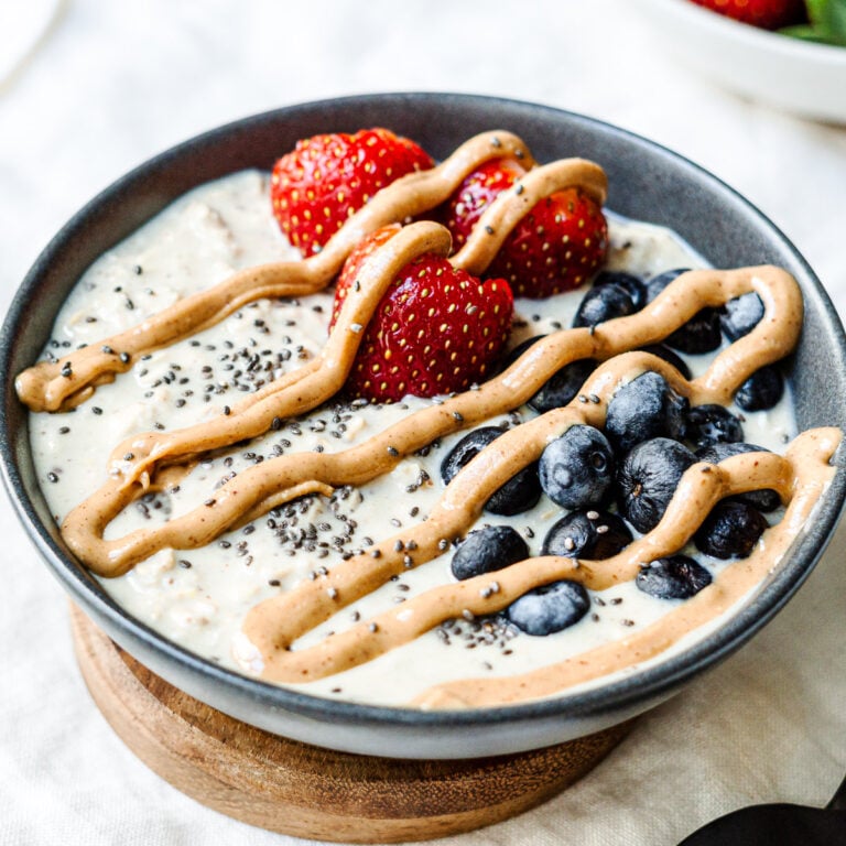 overnight oats served with fruits and drizzled with peanut butter