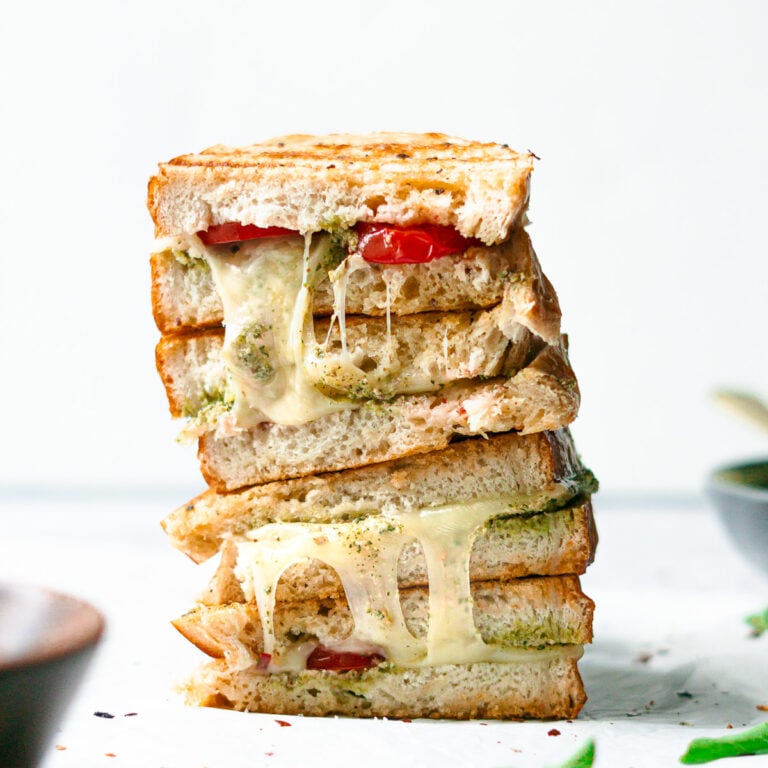 stacked pesto grilled cheese sandwich with tomatoes