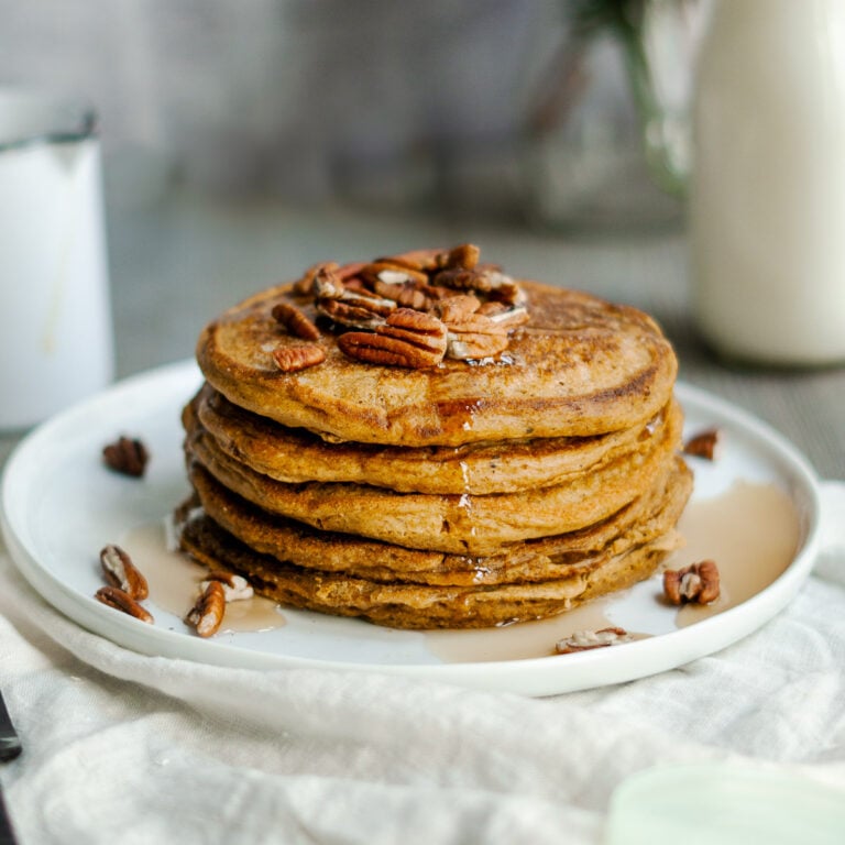 vegan pumpkin pancakes with pecans and syrup