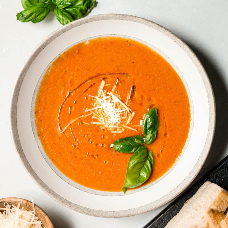 tomato basil soup creamy with Parmesan, basil, and olive oil