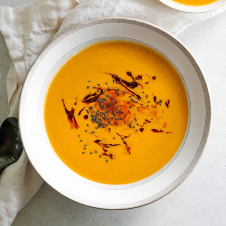 soup garnished with sesame seeds and chili oil